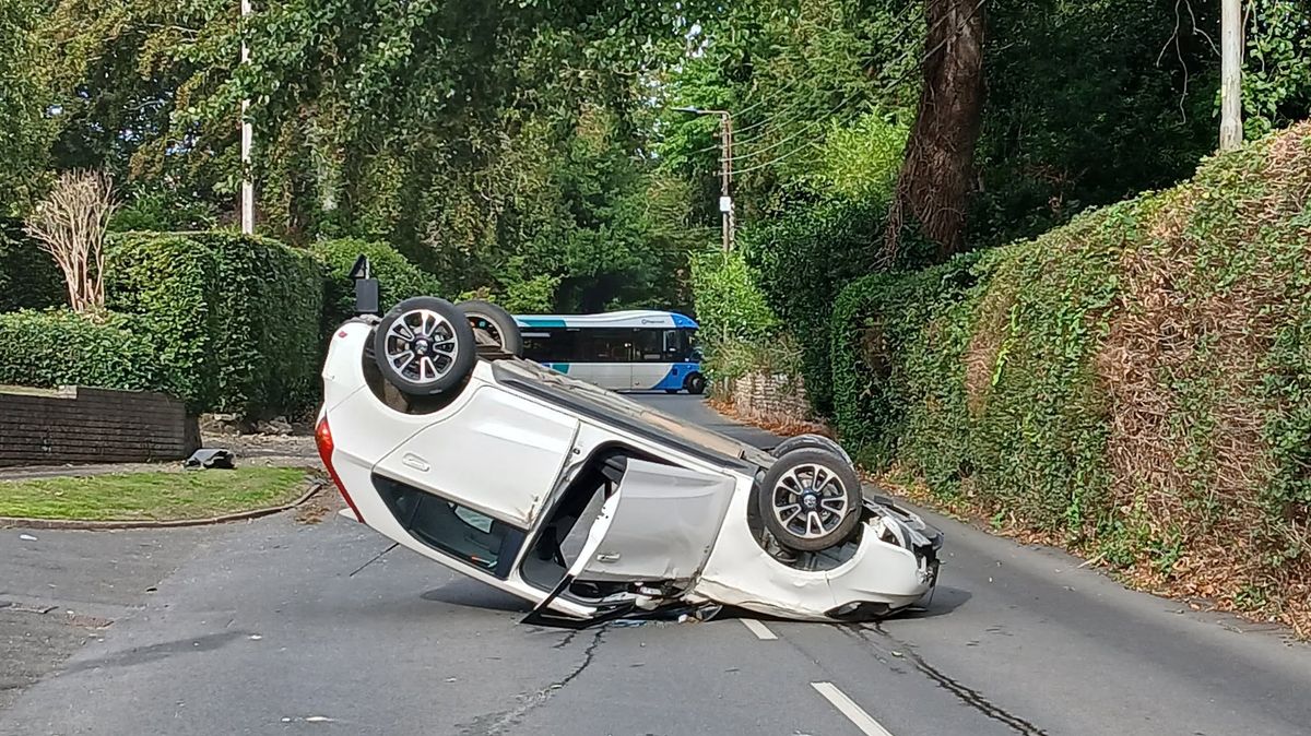 Car Flips Onto Roof, Bus Trapped on Devon Road